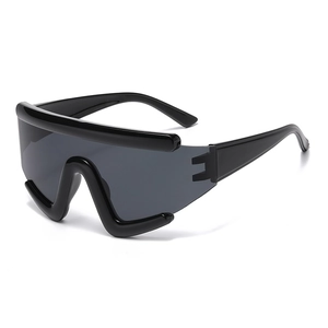 Futuristic black wrap-around cycling sunglasses with oversized lenses for outdoor sports