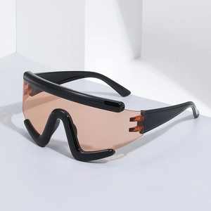 Futuristic oversized cycling sunglasses with black frame and orange gradient lenses