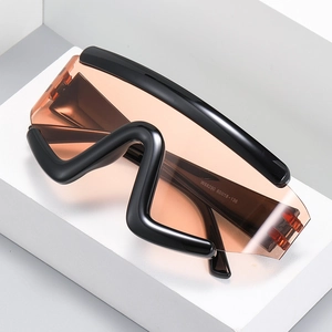 Futuristic wraparound cycling sunglasses with black frame and translucent orange lenses
