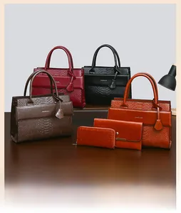 Detail of crocodile pattern leather texture and finish on stylish multi-color handbags