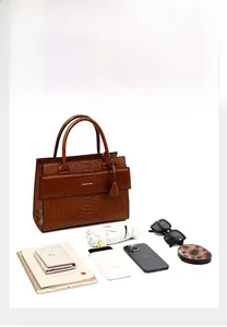 Brown crocodile embossed tote bag showcasing large capacity for daily essentials and tablet