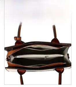 Internal view of brown crocodile texture handbag with organized three-section storage layout