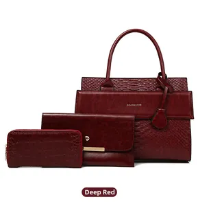 Three-piece red crocodile pattern bag set with tote, envelope clutch, and long wallet