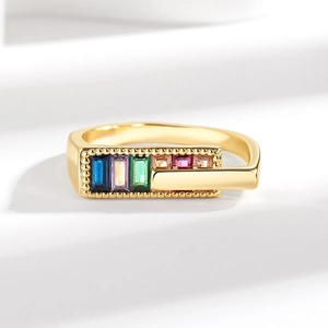 Rainbow rectangle zircon ring in gold finish with a modern overlapping adjustable band