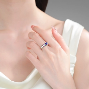 Rainbow rectangle zircon ring in silver finish worn by a model in elegant lighting