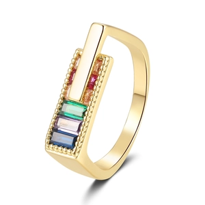 Minimalist gold ring featuring colorful baguette cut zircons in a rectangular setting