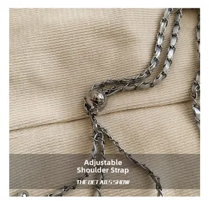 Detail showing silver quilted chain strap with adjustable metal ball buckle for bags