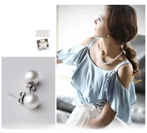 Detail view of 925 silver pearl stud earrings with model lifestyle shot in soft blue tones