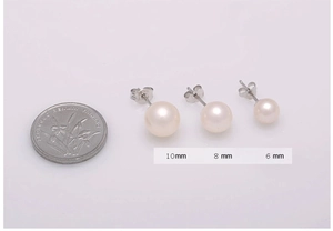 Size comparison of 10mm, 8mm, and 6mm white pearl earrings next to a coin
