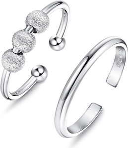 Close-up of S925 sterling silver fidget ring set with frosted beads and polished band