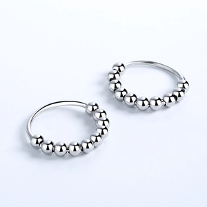 Detailed close-up of 925 silver stress relief ring with ten movable rotating beads