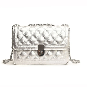 Silver quilted chain bag with metallic finish and rectangular turn-lock closure