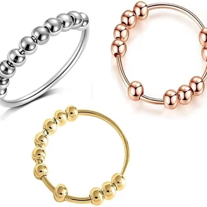 Minimalist spinning anxiety rings in silver, rose gold and gold with movable beads