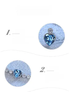Macro detail of faceted heart blue crystal pendant with premium plating and small diamonds