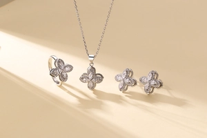 Detailed view of silver clover jewelry set with sparkling marquise cut zircons