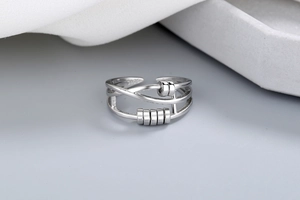 Close-up of a 925 sterling silver spinning bead ring with adjustable open design