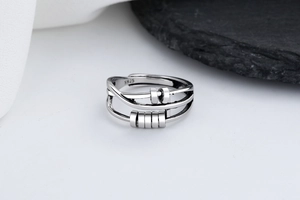 Detailed macro of S925 silver ring with rotatable beads and vintage metallic finish