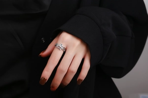 Detailed close-up of a silver layered ring with Smile engraving and sparkling micro-diamonds