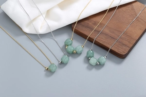 Detail of Nephrite jade bead necklaces in gold and silver plating with minimalist style
