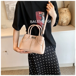 Pink lychee texture leather handbag with round handles and detachable shoulder strap