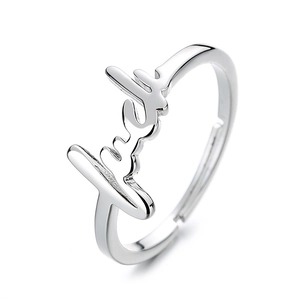 Adjustable silver finish metal ring with cursive lucky letter script design