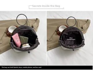 Detail view of the spacious inner main pocket of this stylish shell bag for daily essentials