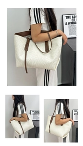 Detail view of woven white leather tote bag with dark brown slim shoulder straps