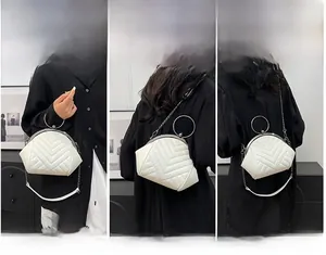Three ways to wear the white quilted shell bag: handbag, shoulder bag, and crossbody style