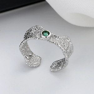 Minimalist silver-tone textured open ring with a vibrant green zircon stone center