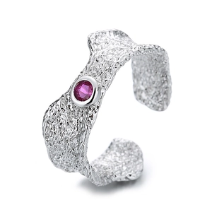 Minimalist silver irregular textured open ring with a round pink zircon stone center