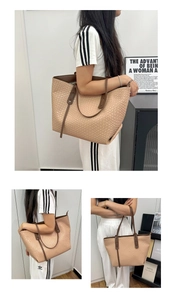 Detail of light beige woven tote bag with textured scale pattern and brown straps