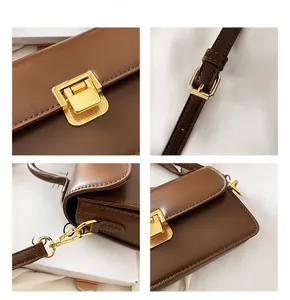 Dettaglio borsa vintage marrone con finiture dorate e consistenza in pelle liscia