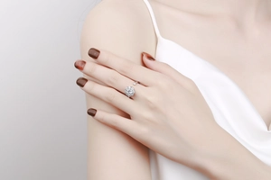 Detail of adjustable silver flower ring with sparkling zircon stones on a model