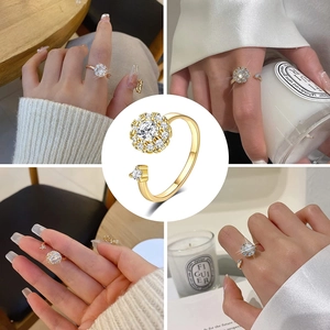 Detailed views of gold butterfly zircon rotating ring set on model and white background
