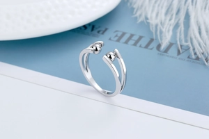 Detail view of adjustable silver spinner ring with double bands and polished beads