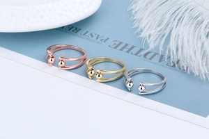 Three-piece set of adjustable anxiety rings in rose gold, gold, and silver finishes