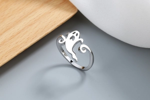 Close-up of a silver ghost-shaped open ring with polished finish for Halloween