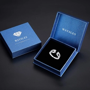 Detail of adjustable S925 silver ring with metal beads in a blue gift box packaging