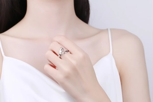 Detailed shot of silver cat ring with hollow Boo design worn on finger for Halloween