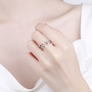 Minimalist adjustable fidget ring for anxiety relief with silver beads on a female hand