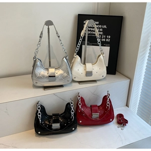 Quilted crescent bags in silver, beige, black, and red with metallic chain details