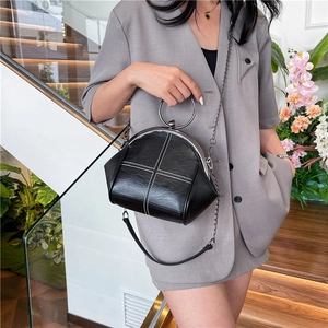 Fashionable black doctor bag with white cross-stitching and metal ring handles