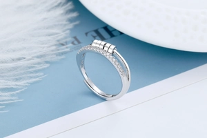 Macro shot of S925 sterling silver spinning ring with zircon stones and adjustable band