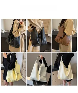 Sac fourre-tout en cuir grainé avec pochette assortie présenté en plusieurs coloris tendance