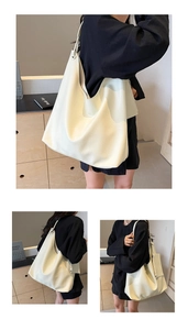Détail du sac cabas blanc crème avec texture grainée et bandoulière au style minimaliste