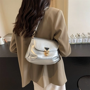 Silver metallic pleated shoulder bag for women with gold hardware and fold-over flap