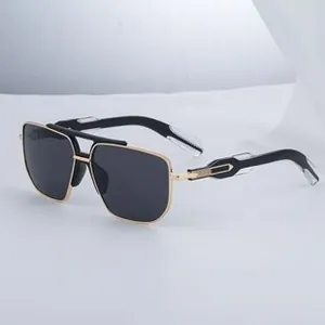 Detail of gold metal double bridge aviator sunglasses with black lenses shown from the side