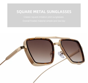 Detail of vintage square metal sunglasses with tortoiseshell accents and gradient lenses