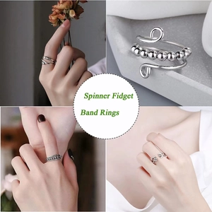 Detailaufnahme von Spinner-Fidget-Ringen mit drehbaren Perlen und Spiralen
