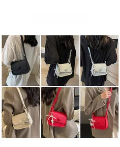 Model view showing the texture and back-carry style of a litchi pattern saddle bag